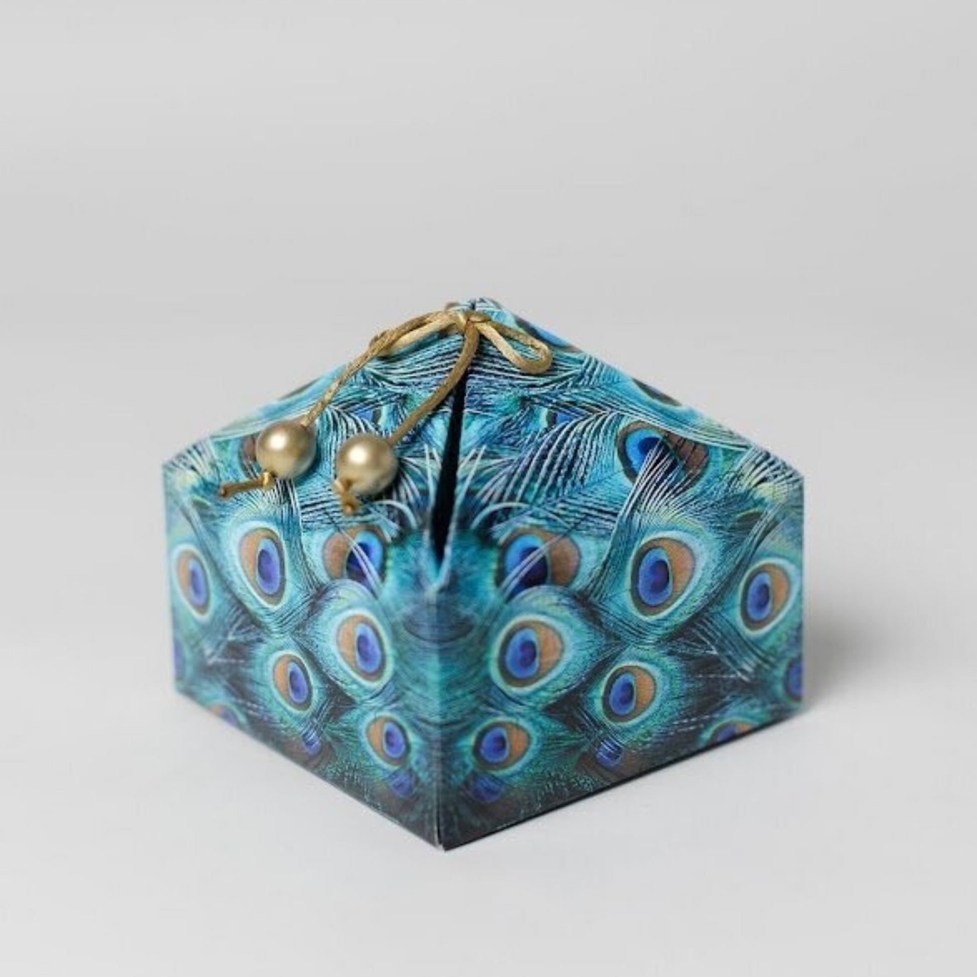 A GREAT HEXANGONAL SHAPED BOX COMPLETE WITH BEADED RIBBON TIE.