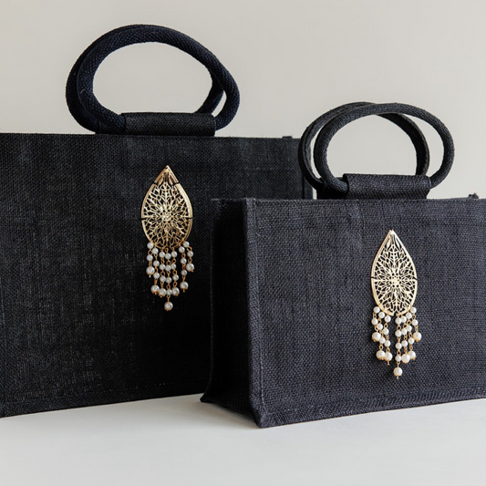 Black coloured gift bag with a *luxury embellishment